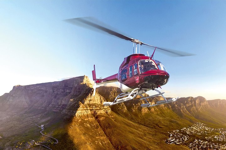 Experience breathtaking views of Cape Town's stunning coastline and majestic mountains with the Cape Town Hopper Helicopter Tour perfect for capturing unforgettable memories from above.